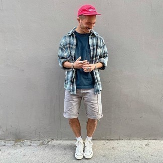 Hot Pink Baseball Cap Outfits For Men: A light blue plaid long sleeve shirt and a hot pink baseball cap are a wonderful outfit that will carry you throughout the day. Add a pair of white canvas high top sneakers to your outfit to make the ensemble slightly dressier.