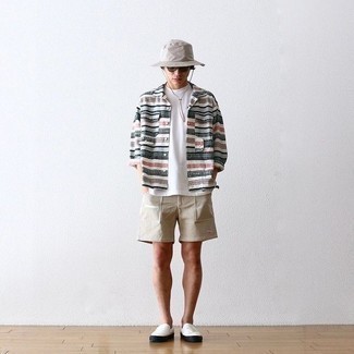 Grey Bucket Hat Outfits For Men: Inject a casual touch into your day-to-day repertoire with a multi colored horizontal striped long sleeve shirt and a grey bucket hat. A pair of white canvas slip-on sneakers effortlessly steps up the fashion factor of your ensemble.