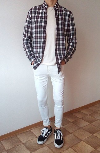 White Skinny Jeans Outfits For Men: Marry a white and black plaid long sleeve shirt with white skinny jeans to feel infinitely confident in yourself and look seriously stylish. If you feel like playing it up a bit, add a pair of black and white canvas low top sneakers to the equation.