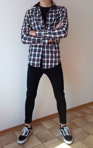 Multi colored Plaid Long Sleeve Shirt Outfits For Men: A multi colored plaid long sleeve shirt looks especially nice when combined with black skinny jeans. Our favorite of a countless number of ways to round off this ensemble is black and white canvas low top sneakers.