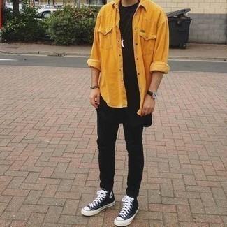 Mustard Long Sleeve Shirt Outfits For Men: Why not opt for a mustard long sleeve shirt and black skinny jeans? Both pieces are super functional and will look awesome when paired together. Send this getup down a more relaxed path by wearing black and white canvas high top sneakers.