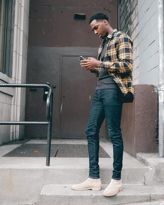Grey Knit Crew-neck T-shirt Outfits For Men: For a casually stylish ensemble, marry a grey knit crew-neck t-shirt with navy skinny jeans — these two pieces go perfectly well together. Add a pair of beige suede chelsea boots to your look to instantly jazz up the outfit.