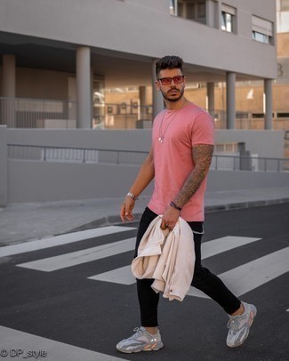 Hot Pink Crew-neck T-shirt Outfits For Men: For something on the cool and laid-back end, try this combo of a hot pink crew-neck t-shirt and black skinny jeans. We're loving how a pair of grey athletic shoes makes this look whole.