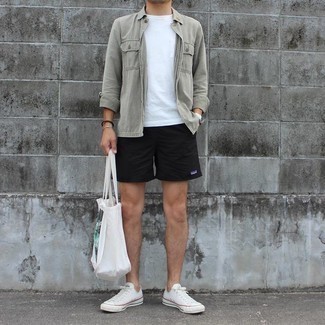 White and Navy Canvas Low Top Sneakers Outfits For Men: This pairing of an olive long sleeve shirt and black sports shorts makes for the ultimate casual style for any modern guy. Want to dial it up with shoes? Add a pair of white and navy canvas low top sneakers to your look.
