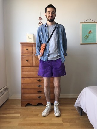 Violet Sports Shorts Outfits For Men: Opt for a blue chambray long sleeve shirt and violet sports shorts for comfort dressing with an edgy spin. When in doubt about the footwear, introduce a pair of beige canvas high top sneakers to your ensemble.