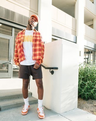 Orange Leather Low Top Sneakers Outfits For Men: An orange plaid long sleeve shirt and dark brown sports shorts are the ideal way to infuse extra cool into your day-to-day styling collection. Orange leather low top sneakers are an effective way to transform this outfit.