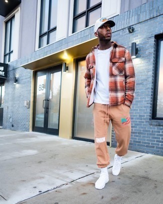 Beige Sweatpants Outfits For Men: For an outfit that's very simple but can be flaunted in a great deal of different ways, choose an orange plaid long sleeve shirt and beige sweatpants. Feeling bold today? Change things up a bit by finishing off with white athletic shoes.