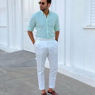 Mint Long Sleeve Shirt Outfits For Men: Channel your inner James Bond and wear a mint long sleeve shirt and white dress pants. Add a more casual finish to by wearing brown leather boat shoes.