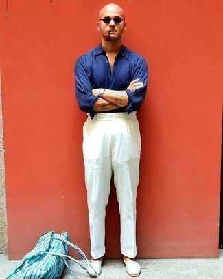 White Canvas Espadrilles Outfits For Men: This elegant combination of a navy linen long sleeve shirt and white dress pants is a popular choice among the style-savvy gentlemen. Infuse a dash of stylish nonchalance into your look with a pair of white canvas espadrilles.
