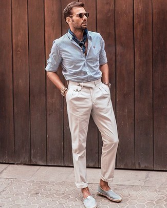 White Vertical Striped Long Sleeve Shirt Outfits For Men: Opt for a white vertical striped long sleeve shirt and beige dress pants to have all eyes on you. A pair of light blue canvas espadrilles can instantly dial down an all-too-classic outfit.