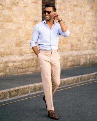 Dark Brown Leather Loafers Outfits For Men: This combo of a light blue long sleeve shirt and beige dress pants is a never-failing option when you need to look incredibly sharp. When not sure about what to wear when it comes to footwear, go with a pair of dark brown leather loafers.