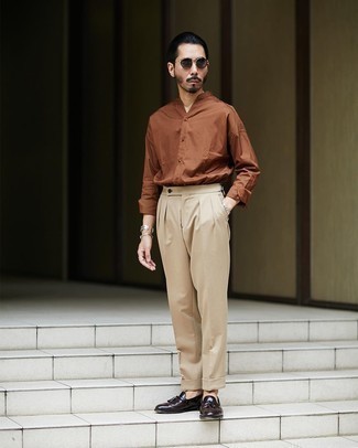 Dark Brown Leather Tassel Loafers Outfits: Go all out in a brown long sleeve shirt and khaki dress pants. Let your sartorial credentials truly shine by completing this outfit with dark brown leather tassel loafers.