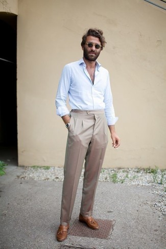 Tobacco Leather Tassel Loafers Outfits: This look clearly illustrates it is totally worth investing in such timeless menswear pieces as a light blue long sleeve shirt and beige dress pants. This getup is complemented wonderfully with tobacco leather tassel loafers.