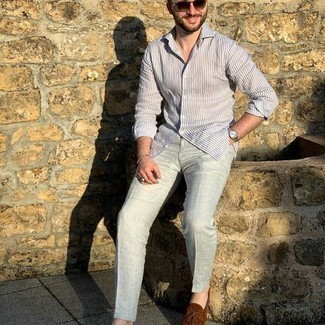 Beige Beaded Bracelet Outfits For Men: This pairing of a white and blue vertical striped long sleeve shirt and a beige beaded bracelet is solid proof that a pared down casual look can still look really dapper. For a more sophisticated aesthetic, add brown suede tassel loafers.