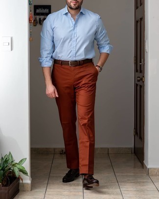 Dark Brown Leather Tassel Loafers Outfits: Marrying a light blue long sleeve shirt and tobacco dress pants is a surefire way to infuse your styling arsenal with some rugged sophistication. Introduce a pair of dark brown leather tassel loafers to the mix and the whole look will come together really well.