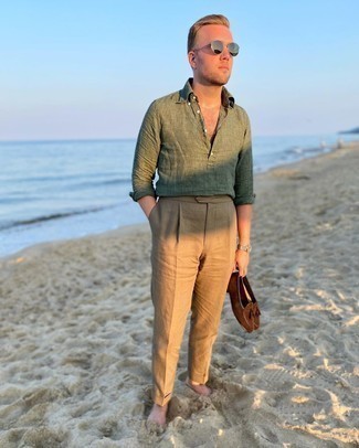 43 Dressy Hot Weather Outfits For Men: This combination of an olive linen long sleeve shirt and khaki linen dress pants epitomizes masculine refinement. If in doubt as to what to wear on the footwear front, go with a pair of dark brown suede tassel loafers.