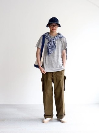Brown Cargo Pants Outfits: For an ensemble that delivers function and style, opt for a white and navy gingham long sleeve shirt and brown cargo pants. If you need to immediately up the style ante of this ensemble with shoes, why not introduce a pair of white canvas slip-on sneakers to the equation?