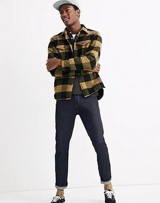 Beige Gingham Flannel Long Sleeve Shirt Outfits For Men: A beige gingham flannel long sleeve shirt and navy jeans will allow you to showcase your fashionable side. Introduce a pair of black and white canvas low top sneakers to this look et voila, the getup is complete.
