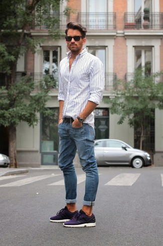 Violet Athletic Shoes with Blue Jeans Outfits For Men: If you're on the lookout for an off-duty and at the same time on-trend outfit, wear a white and navy vertical striped long sleeve shirt and blue jeans. Complete your ensemble with a pair of violet athletic shoes to mix things up.