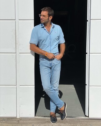 Men's Light Blue Long Sleeve Shirt, Light Blue Jeans, Black Leather Boat Shoes, Clear Sunglasses