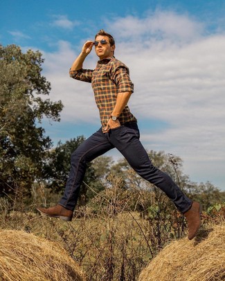 Brown Suede Chelsea Boots Outfits For Men: The go-to for cool casual style for men? An orange check long sleeve shirt with navy jeans. Introduce brown suede chelsea boots to the equation to shake things up.