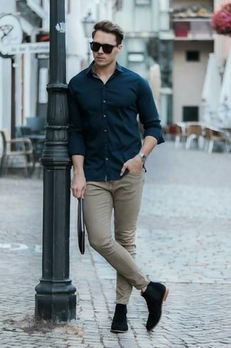 Navy Long Sleeve Shirt Outfits For Men: You're looking at the definitive proof that a navy long sleeve shirt and grey jeans look awesome when you team them up in a casual getup. Here's how to elevate this ensemble: black suede chelsea boots.