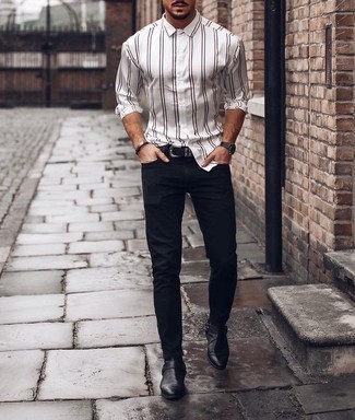 White Vertical Striped Long Sleeve Shirt Outfits For Men: For practicality without the need to sacrifice on fashion, we turn to this combination of a white vertical striped long sleeve shirt and navy jeans. And if you wish to instantly bump up this outfit with a pair of shoes, introduce a pair of black leather chelsea boots to your look.