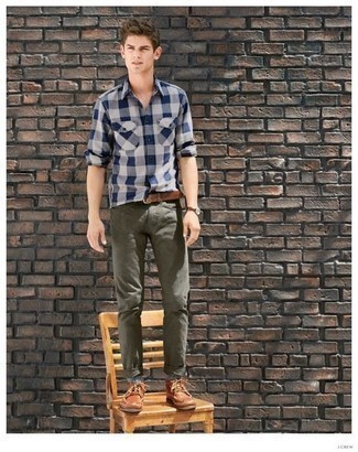 Olive Jeans Outfits For Men: If you're after a relaxed and at the same time sharp getup, go for a white and navy gingham long sleeve shirt and olive jeans. Hesitant about how to finish off your outfit? Rock a pair of brown leather derby shoes to amp up the wow factor.