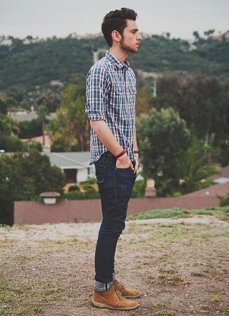 Red Bracelet Outfits For Men: Super dapper, this combo of a navy plaid long sleeve shirt and a red bracelet will provide you with variety. To add elegance to your outfit, finish off with a pair of tan suede desert boots.