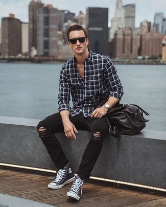 Navy and White Canvas High Top Sneakers Outfits For Men: Make a black and white plaid long sleeve shirt and black ripped jeans your outfit choice for a casual outfit. The whole outfit comes together if you complement your look with navy and white canvas high top sneakers.