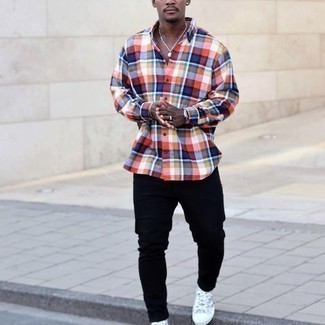 Grey Print Canvas High Top Sneakers Outfits For Men: A multi colored plaid long sleeve shirt and navy jeans matched together are a perfect match. For something more on the cool and casual side to complete this outfit, complement your look with grey print canvas high top sneakers.