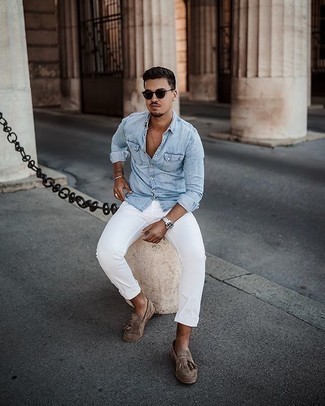 Tan Fringe Suede Loafers Outfits For Men: Solid proof that a light blue chambray long sleeve shirt and white jeans look awesome when teamed together in a laid-back menswear style. Tap into some Ryan Gosling stylishness and add a pair of tan fringe suede loafers to this outfit.