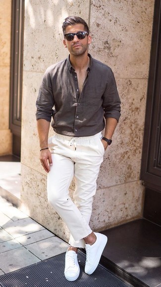 Dark Brown Linen Long Sleeve Shirt Outfits For Men: If you're after a laid-back but also stylish ensemble, consider pairing a dark brown linen long sleeve shirt with white jeans. If not sure about what to wear in the shoe department, complete your outfit with white low top sneakers.