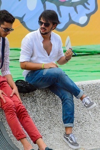 Men's White Linen Long Sleeve Shirt, Blue Ripped Jeans, Grey Suede Low Top Sneakers, Charcoal Sunglasses