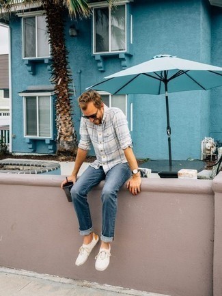 White and Blue Plaid Long Sleeve Shirt Outfits For Men: When the setting permits a casual ensemble, pair a white and blue plaid long sleeve shirt with blue jeans. White canvas low top sneakers will pull the whole thing together.