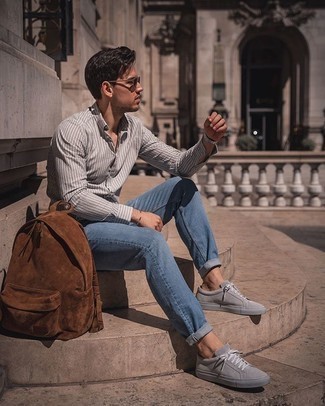 Tobacco Suede Backpack Outfits For Men: The combination of a grey vertical striped long sleeve shirt and a tobacco suede backpack makes for a solid laid-back menswear style. If you want to break out of the mold a little, enter a pair of grey suede low top sneakers into the equation.