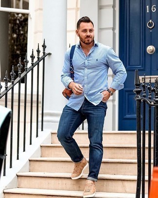 White Vertical Striped Long Sleeve Shirt Outfits For Men: Pairing a white vertical striped long sleeve shirt with navy jeans is an on-point idea for a laid-back yet seriously stylish ensemble. Let your outfit coordination chops truly shine by completing this outfit with a pair of tan canvas low top sneakers.