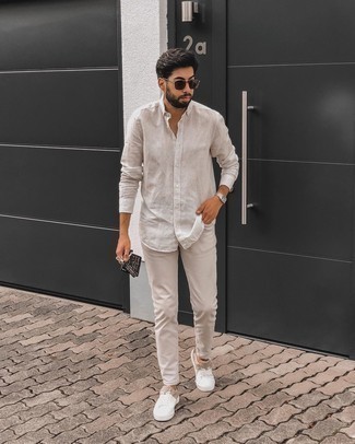 White Sneakers with Beige Jeans Casual Summer Outfits For Men: Teaming a beige vertical striped long sleeve shirt with beige jeans is an awesome pick for a relaxed casual yet on-trend look. Dial down the classiness of this ensemble with white sneakers. As this combo suggests, you can't think of a better idea for warm weather.