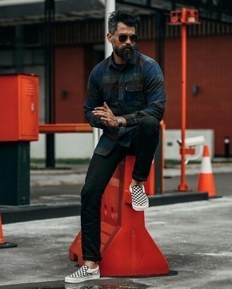 Black Canvas Slip-on Sneakers Outfits For Men: If it's comfort and functionality that you're seeking in menswear, rock a navy gingham long sleeve shirt with black jeans. Complement this getup with a pair of black canvas slip-on sneakers and you're all done and looking boss.