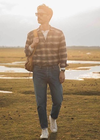 Brown Plaid Long Sleeve Shirt Outfits For Men: A brown plaid long sleeve shirt and navy jeans are a nice combo to add to your day-to-day collection. Feeling inventive today? Jazz things up by slipping into white canvas high top sneakers.