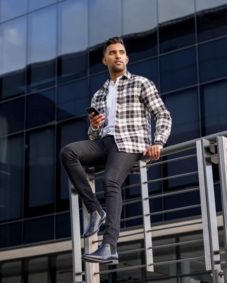 White and Navy Plaid Long Sleeve Shirt Outfits For Men: Go for a white and navy plaid long sleeve shirt and black skinny jeans to get an off-duty and absolutely dapper look. Complete this ensemble with black leather chelsea boots for a touch of sophistication.