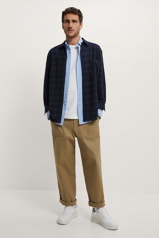 Navy Plaid Long Sleeve Shirt Outfits For Men: A navy plaid long sleeve shirt and a navy plaid long sleeve shirt are a nice combo worth integrating into your casual wardrobe. If you're on the fence about how to round off, a pair of white leather low top sneakers is a goofproof option.