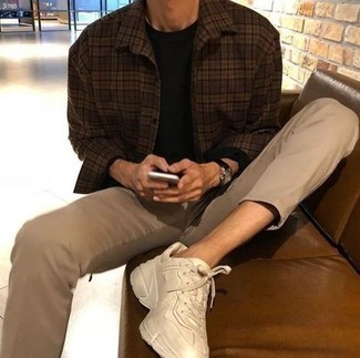 Brown Plaid Long Sleeve Shirt Outfits For Men: Team a brown plaid long sleeve shirt with khaki chinos to create a casually dapper look. You could perhaps get a bit experimental on the shoe front and play down this look by slipping into a pair of beige athletic shoes.