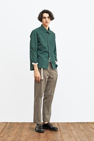 Dark Green Long Sleeve Shirt Outfits For Men: This casual combo of a dark green long sleeve shirt and brown chinos is perfect when you need to go about your day with confidence in your outfit. Black leather derby shoes will easily dress up your ensemble.