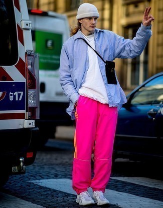 Hot Pink Sweatpants Outfits For Men: If you’re a jeans-and-a-tee kind of guy, you'll like the straightforward pairing of a light blue vertical striped long sleeve shirt and hot pink sweatpants. A great pair of grey athletic shoes is the simplest way to bring a dash of stylish casualness to your look.
