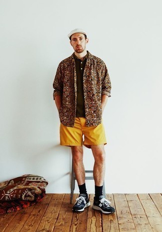 500+ Relaxed Outfits For Men: For something on the off-duty end, try this combination of an orange print long sleeve shirt and mustard sports shorts. If you don't know how to finish off, complement your look with black and white athletic shoes.