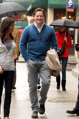 Brendan Fraser wearing Grey Jeans, White Long Sleeve Shirt, Teal Shawl-Neck Sweater, Beige Trenchcoat