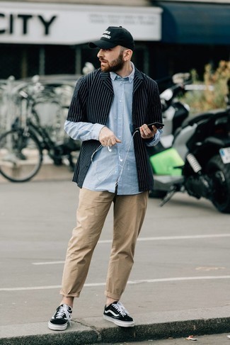 Light Blue Vertical Striped Long Sleeve Shirt Outfits For Men: For a casual getup, consider pairing a light blue vertical striped long sleeve shirt with khaki chinos — these pieces fit perfectly well together. When not sure about what to wear when it comes to shoes, opt for black and white canvas low top sneakers.