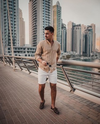 White Shorts Outfits For Men: On days when comfort is the priority, choose a tan long sleeve shirt and white shorts. Add dark brown leather boat shoes to this ensemble and off you go looking boss.