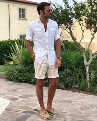 White Vertical Striped Shorts Outfits For Men: To don a casual ensemble with a modernized spin, pair a white linen long sleeve shirt with white vertical striped shorts. Let your styling skills really shine by finishing off this outfit with a pair of tan suede boat shoes.